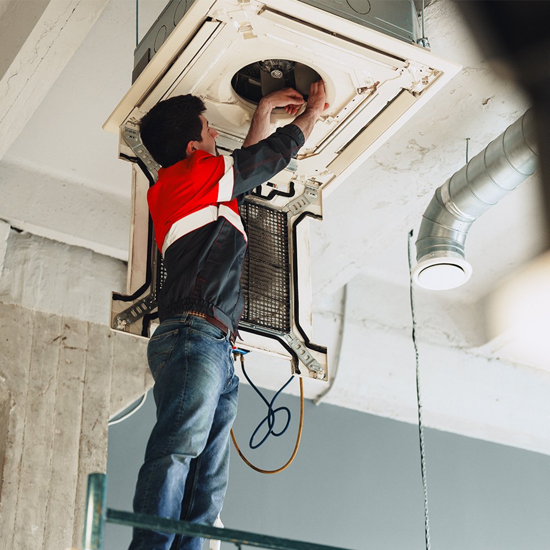 HVAC-engineer-repairing-industrial-compressor