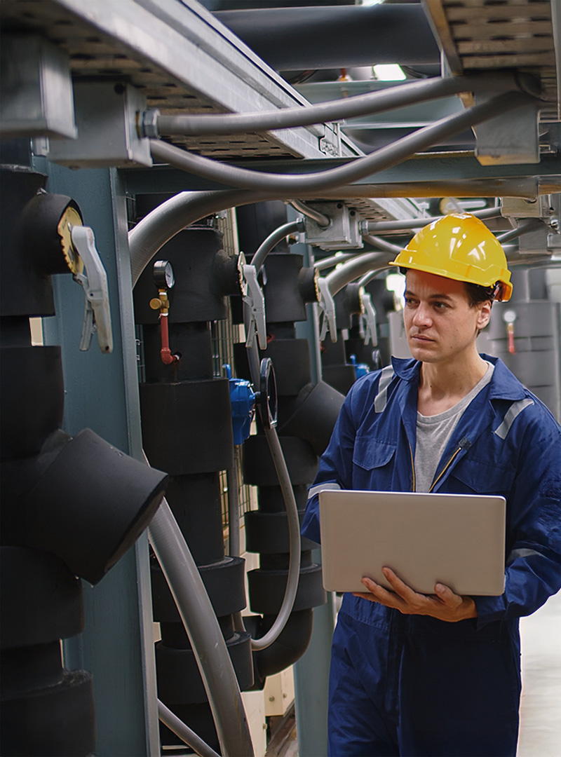 engineer-using-laptop-to-check-A-C-1 engineer-using-laptop-to-check-A-C-1
