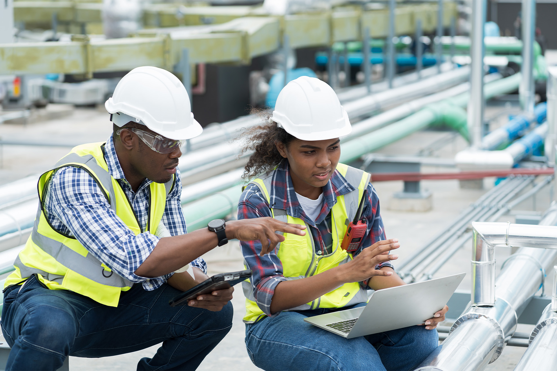 man and woman working on leak detection HVAC man and woman working on leak detection HVAC